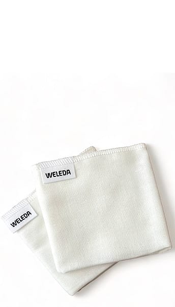 two white muslin cloths folded.