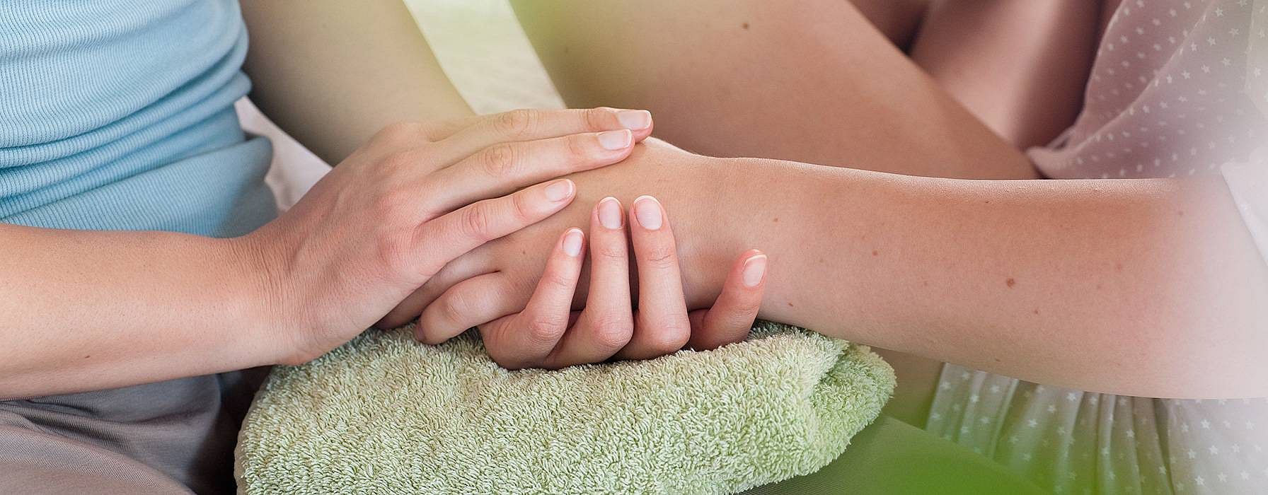 Woman doing hand massage.
