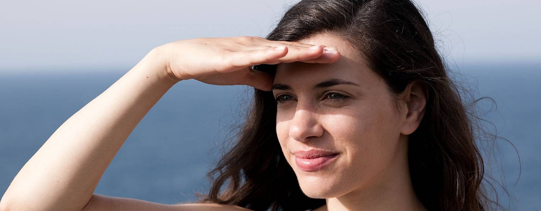 Woman looking into the horizon.