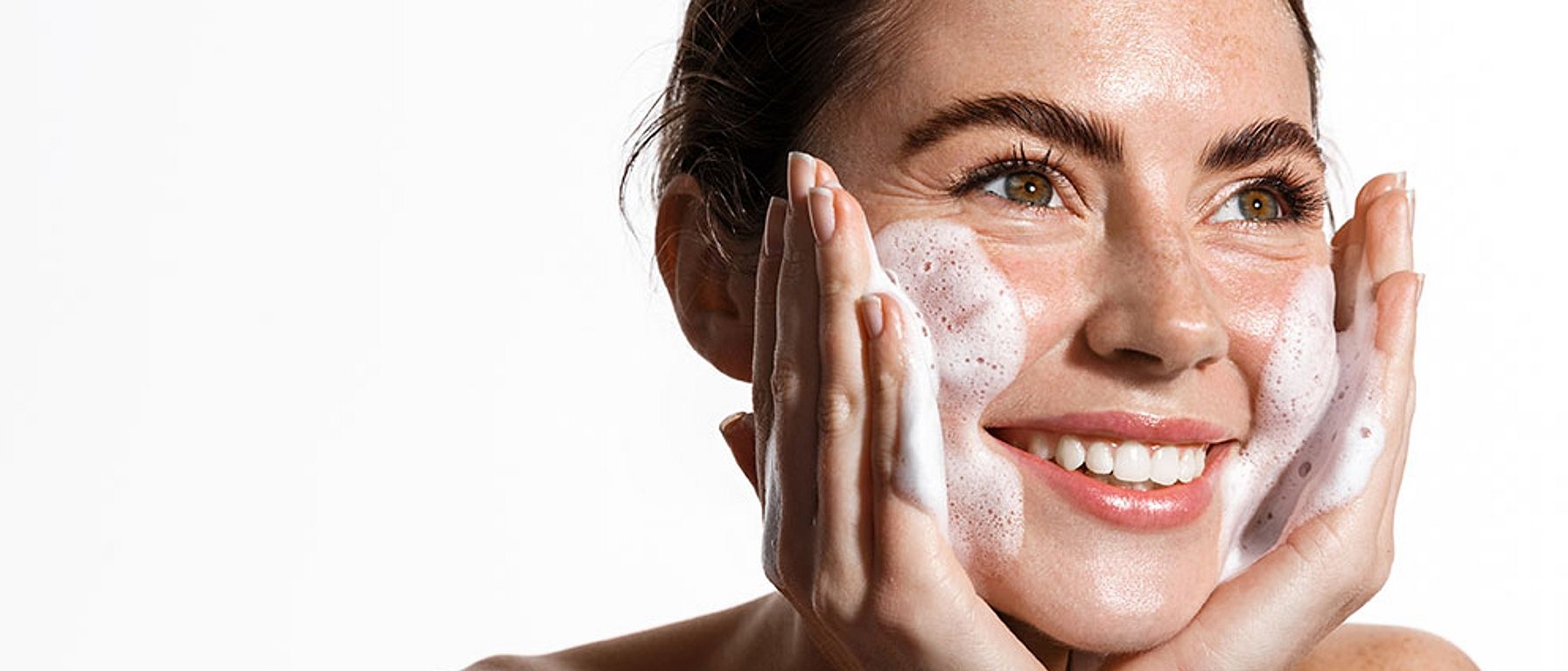 Massaging cleansing foam in the face