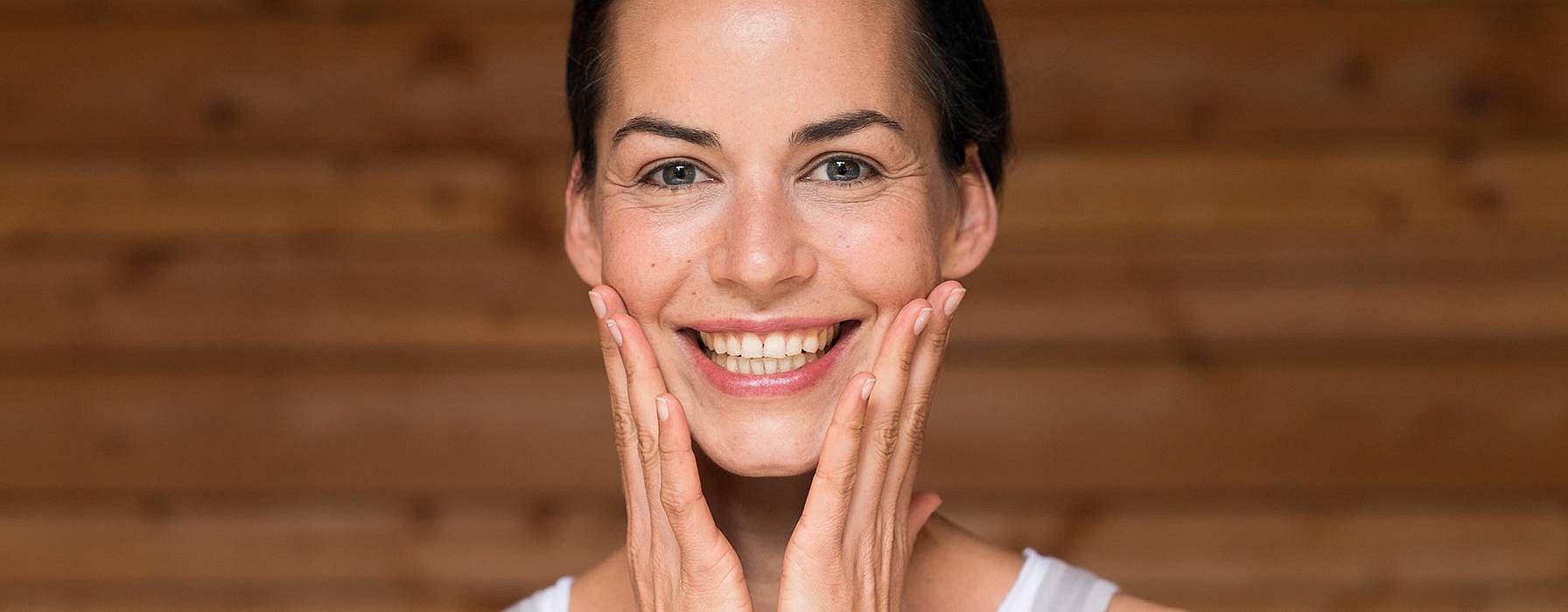 Woman touching her face