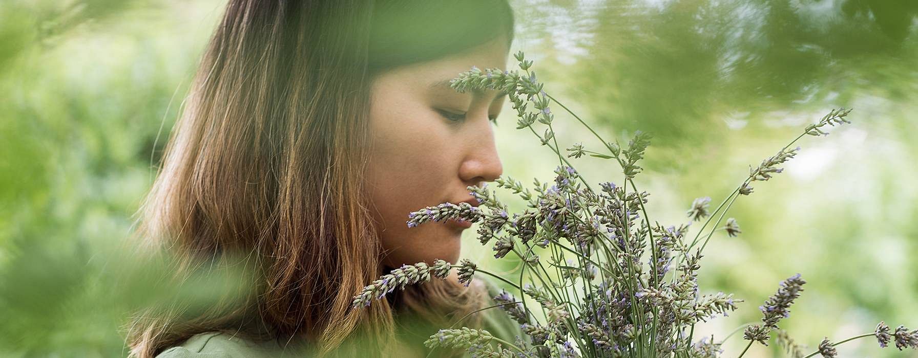 Woman smelling flowers
