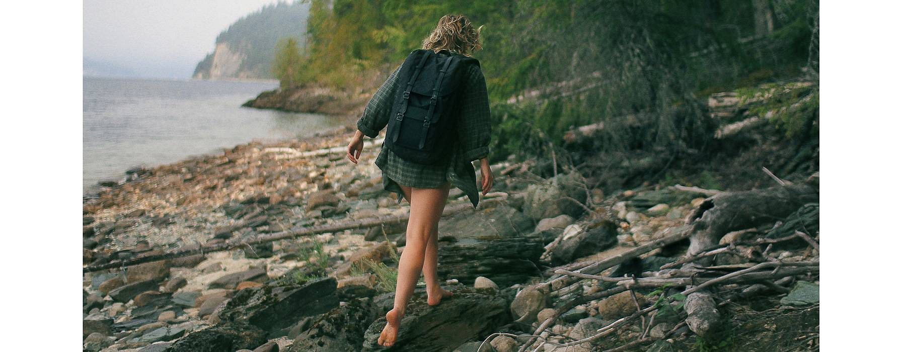 Barfoot woman on rocks