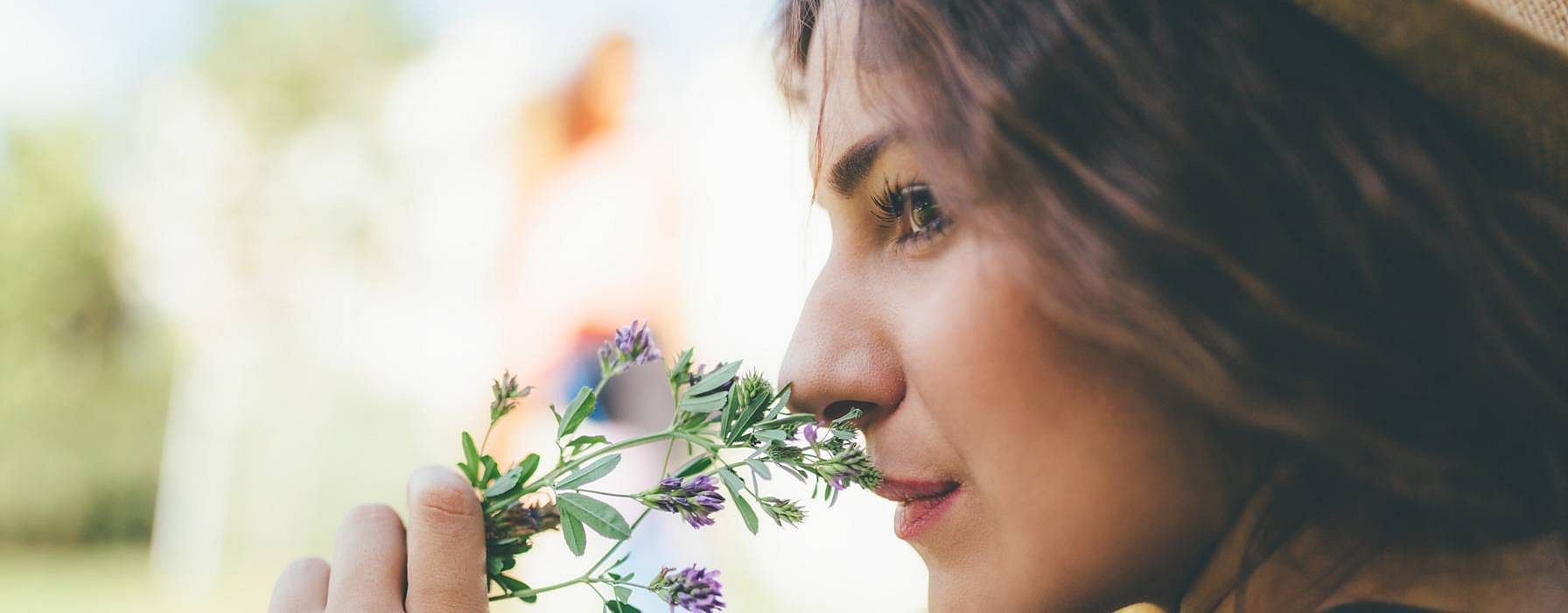 Girl smelling flowers