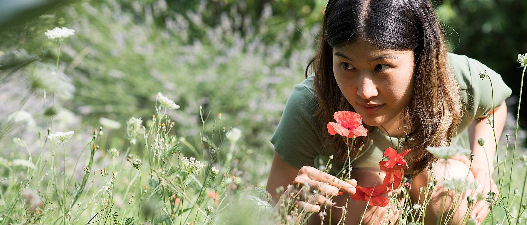 Woman smelling flowers