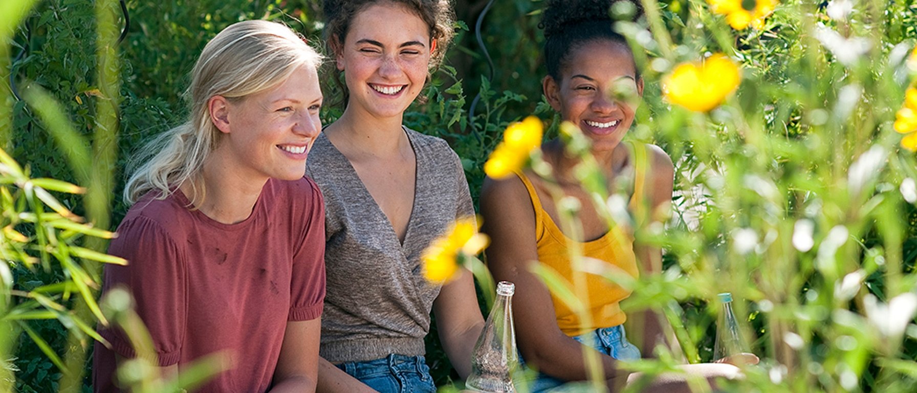 Three teen girls in a garden