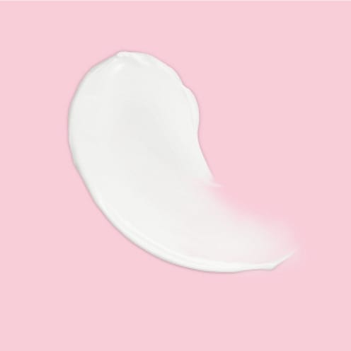 White cream on a pink background.