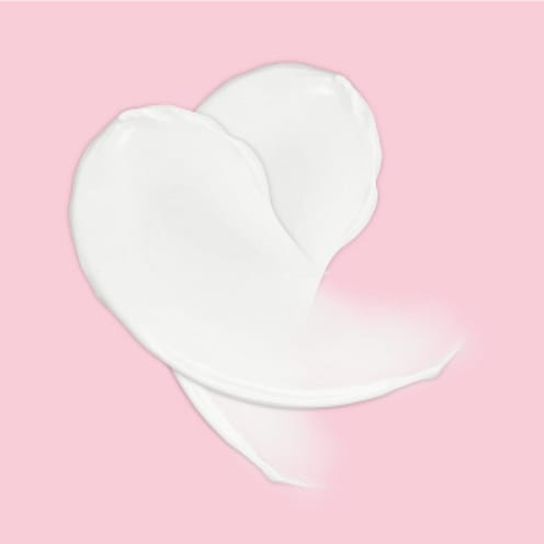 White cream on a pink background.