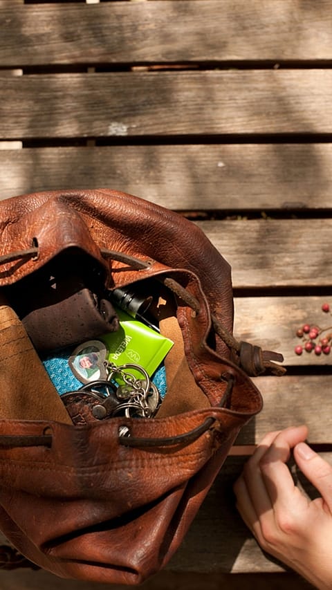 handbag full of personal stuff and weleda product.