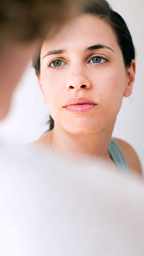 woman gazing attentively at someone