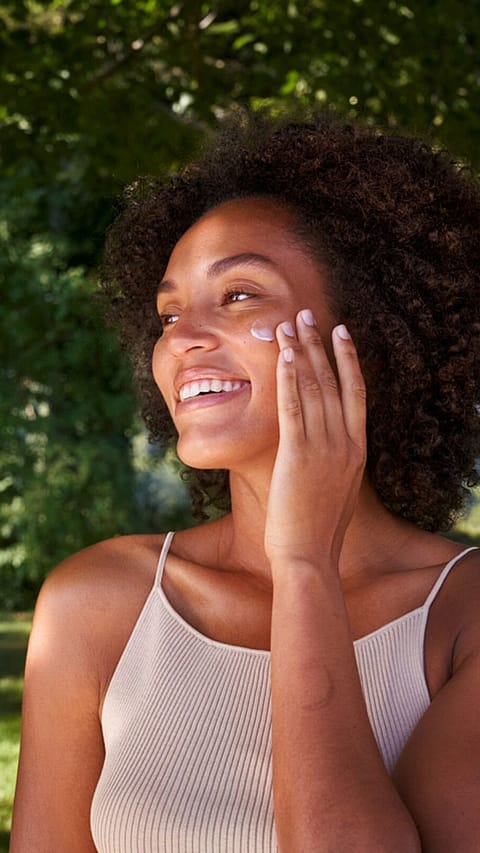 woman applying face cream