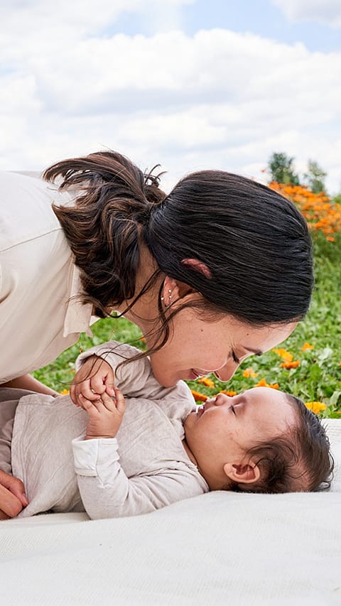 Mother kissing baby
