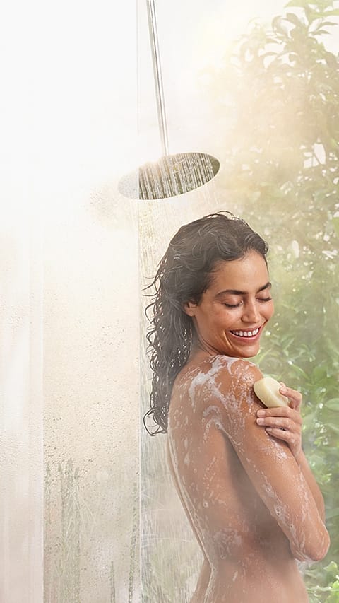 Woman smilin shower.