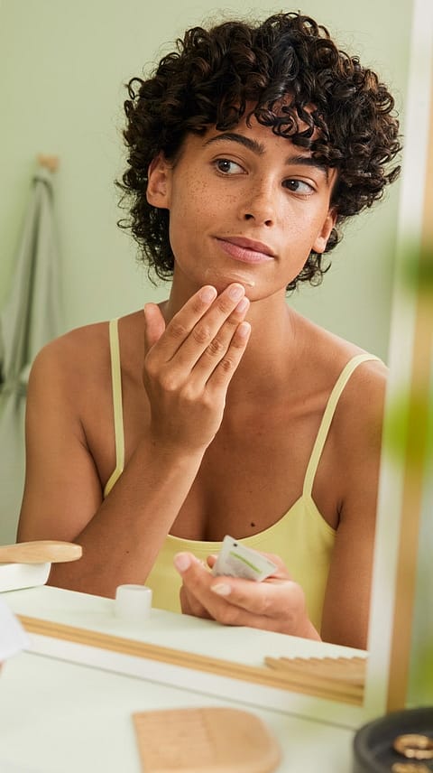 woman cleaning face