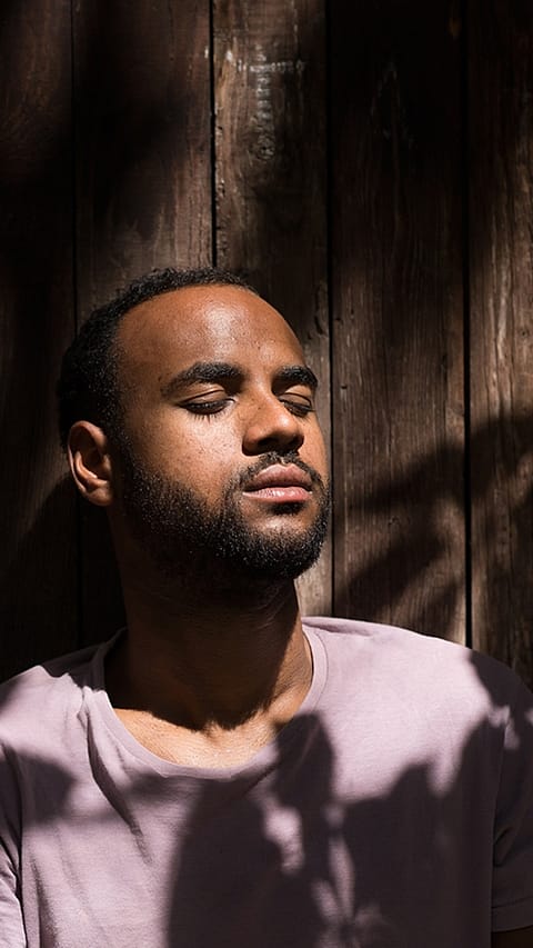 Man receiving sun on his face.