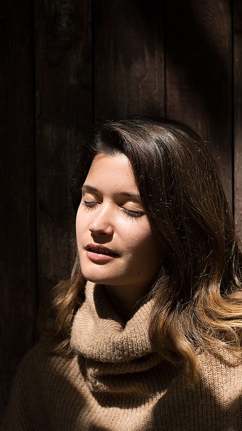 Woman receiving sun on her face.