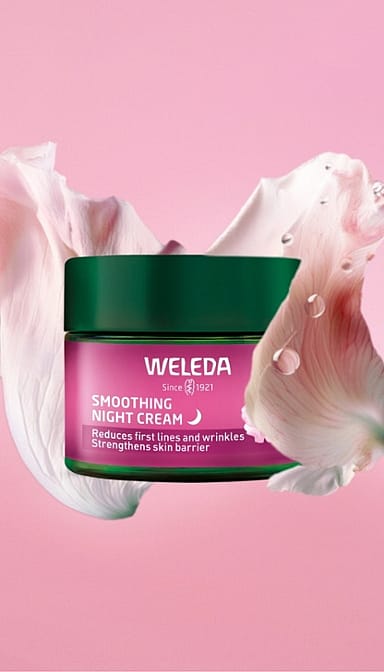 Smoothing Night Cream Wild Rose & White Tea surrounded by a wild rose petal.
