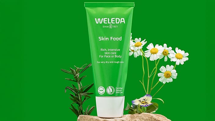 Woman holding Skin Food Origanal with review text 