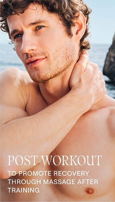 shirtless man by the sea, gently massaging his neck with text.