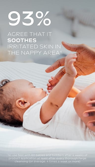 Dark skin baby lying down and holding mother's finger with Calendula nappy change cream fragrance free text.