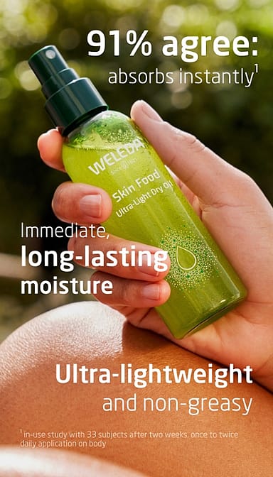 Woman's hand holding Skin Food Ultra-Light Dry Oil bottle surrounded by benefits text.