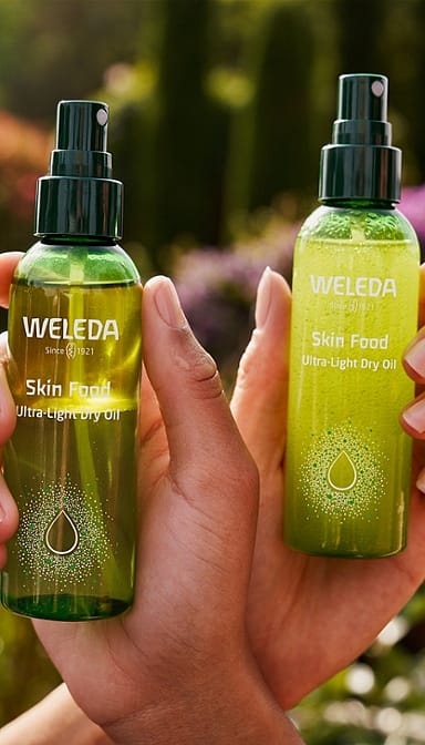 Two bottles of Skin Food Ultra-Light Dry Oil. One shaken and one still.