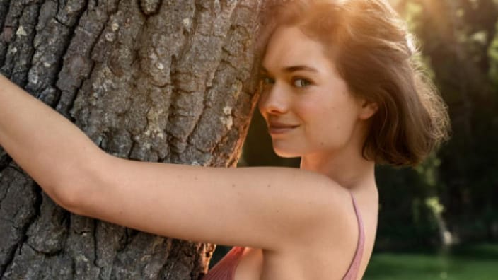 Woman hugging a tree