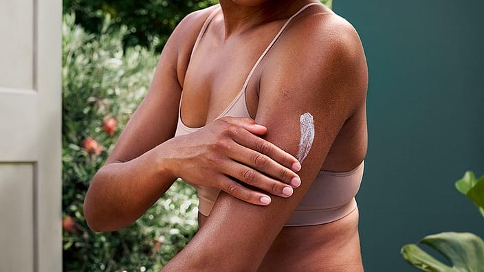 Woman applying cream