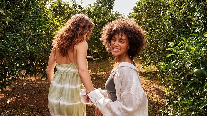 Two women in orchard