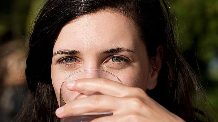 Girl drinking Organic Bircj Elixir