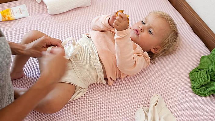 Baby lying on change table
