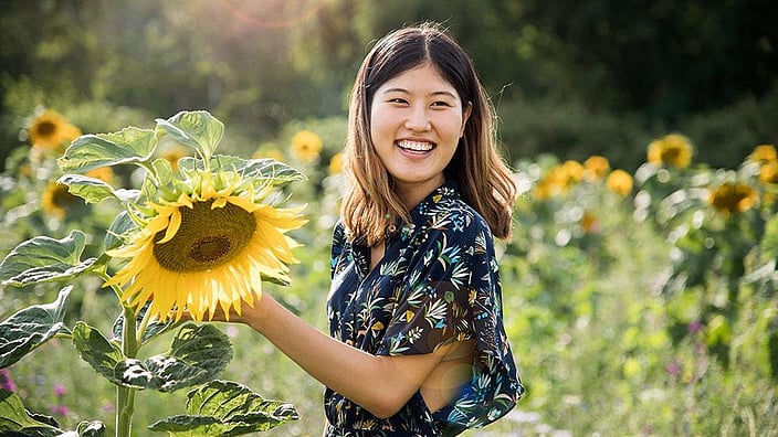 Lady holding big sunflower