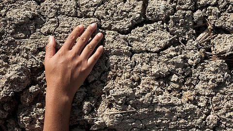 hand on stone wall