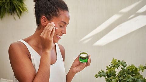 woman applying face cream
