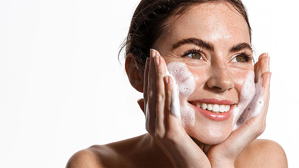 Massaging cleansing foam in the face