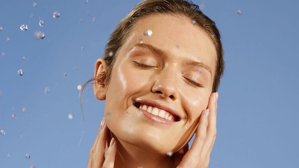 Woman smiling with eyes closed