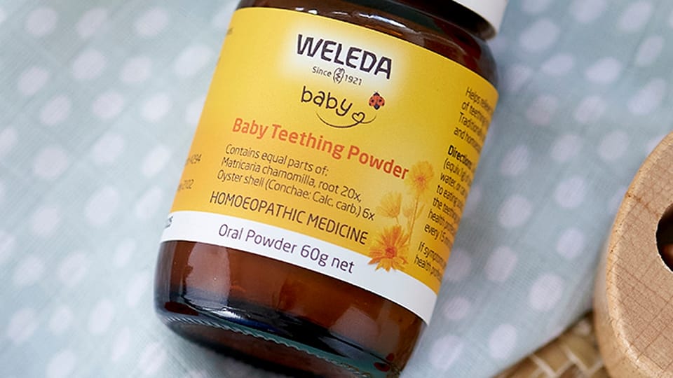 Baby Teething Powder on baby blanket.