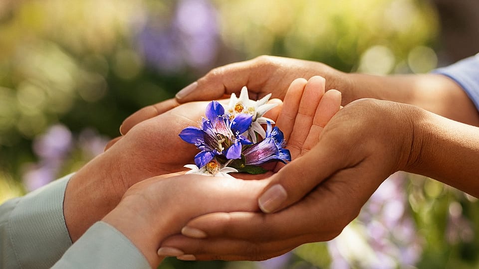 Hands holding flowers