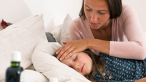 Mother strokes sick child