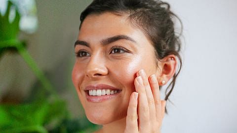 Woman touching her face