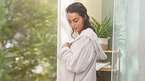 Woman in a bath robe.