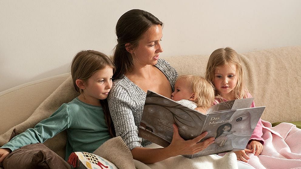 mother reading to her kids