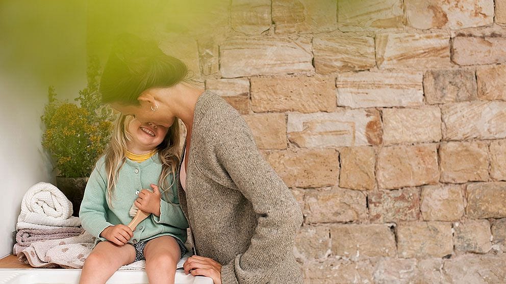 mother and girl laughing