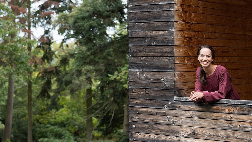 woman smiling from balcony