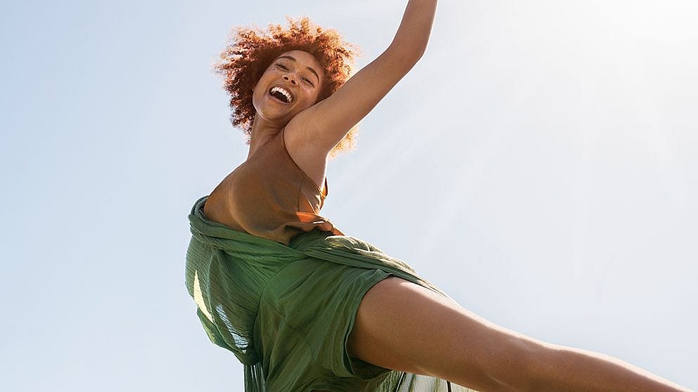 Woman smiling and dancing