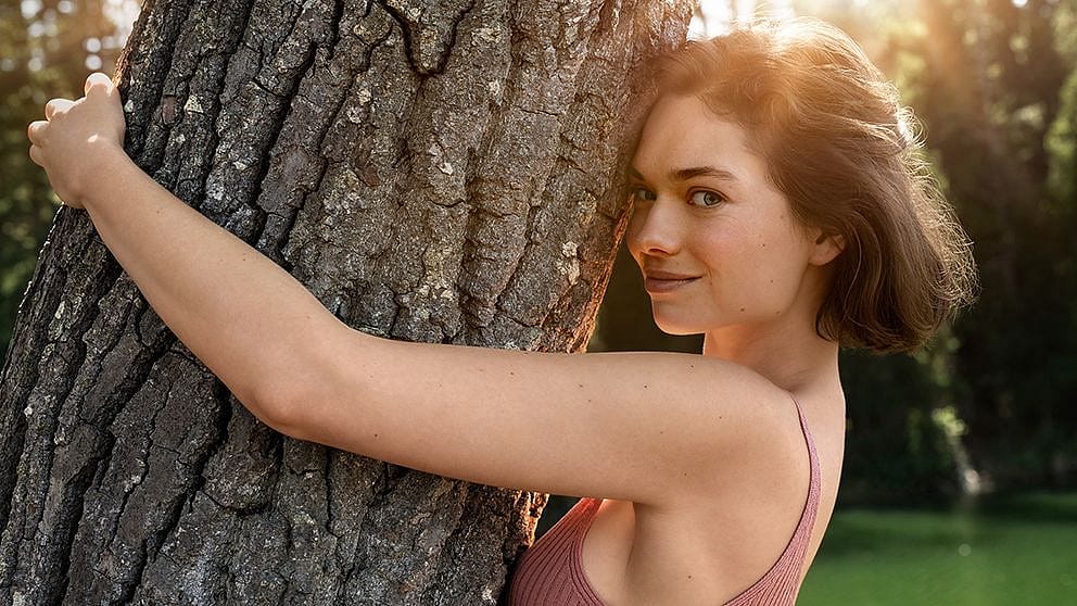 Woman hugging a tree