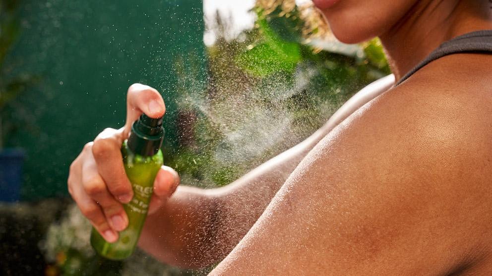 Woman applying Skin Food Ultra Light Dry Oil