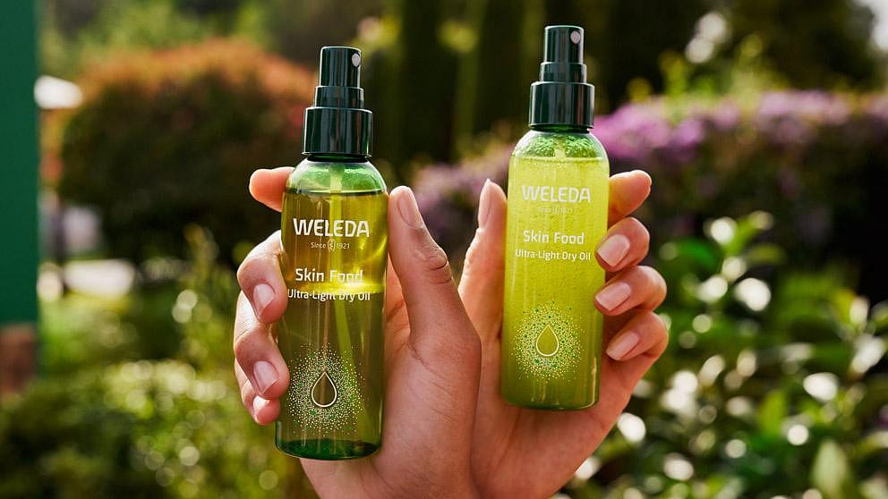 Two hands holding spray