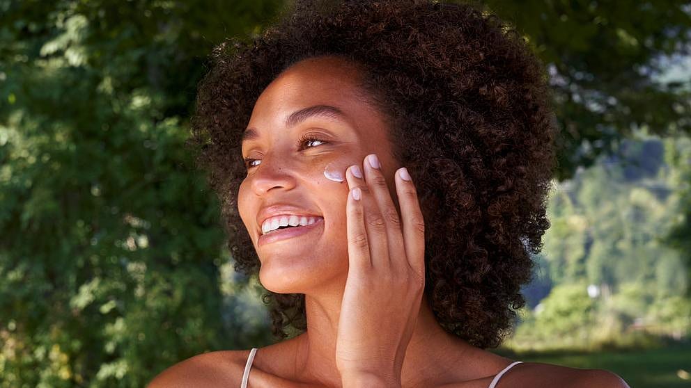 woman applying face cream