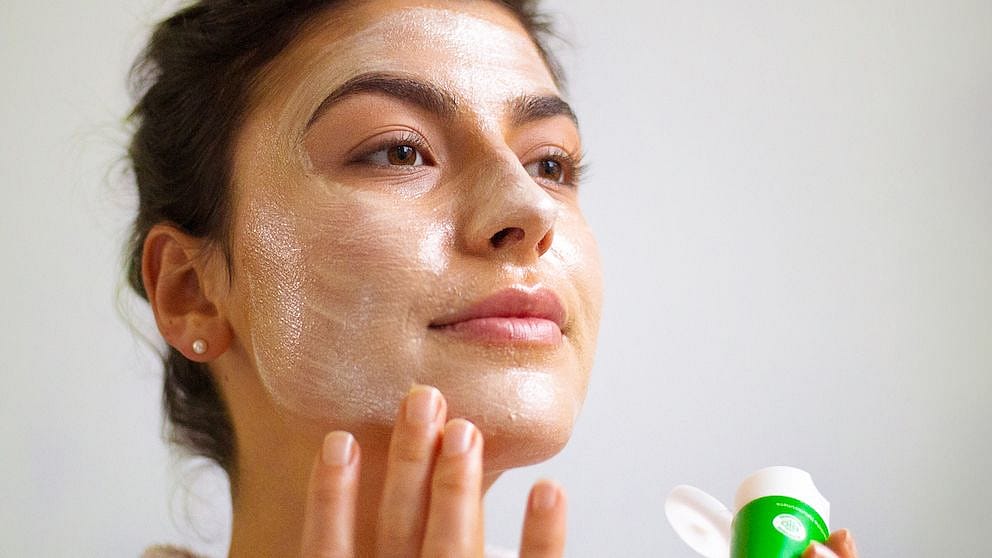 woman applying face mask